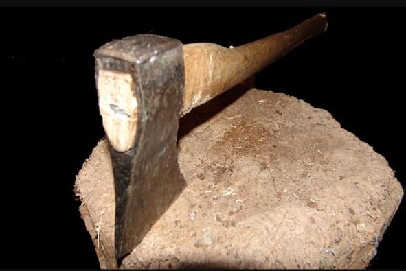 A blood stained axe and ‘rungu’ found at Bondeni murder scene